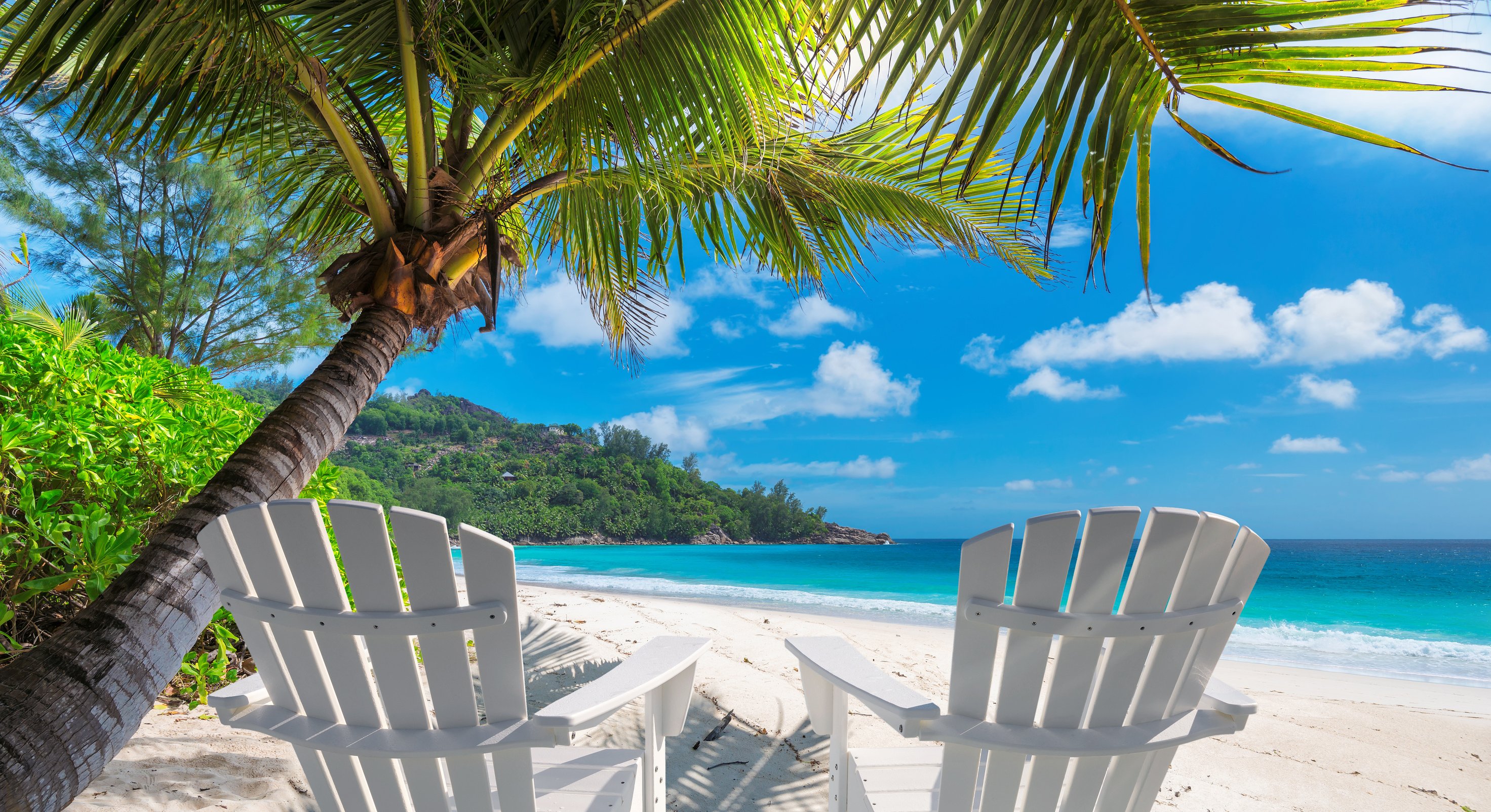 Beach chairs on tropical beach